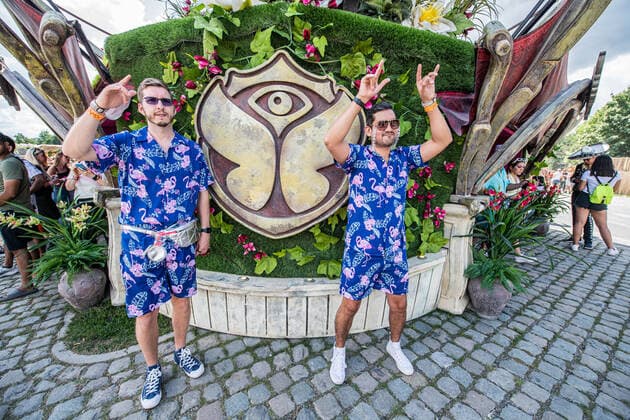 Identically dressed festival goers pose for the photographer during the first day of the Tomorrowland electronic music festival, Friday 15 July 2022, in Boom. The 16th edition of the festival takes place on three weekends at the De Schorre terrain in Boom, from 15 to 17 July, from 22 to 24 July 2022 and from 29 to 31 July. The festival had to be postponed for two years in the ongoing corona virus pandemic.  JONASxROOSENS 37506774