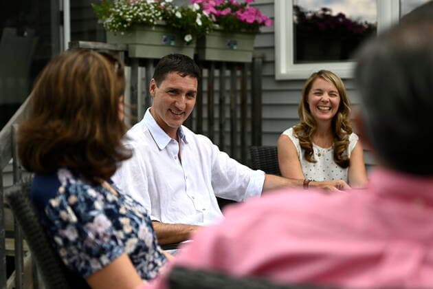 July 15, 2022, Ottawa, ON, CAN: Prime Minister Justin Trudeau and Liberal MP Jenna Sudds speak with the Matin family about the Climate Action Incentive Payment at their backyard in Ottawa, on Friday, July 15, 2022. Ottawa CAN  - ZUMAc35_ 20220715_zaf_c35_046 Copyright: xJustinxTangx