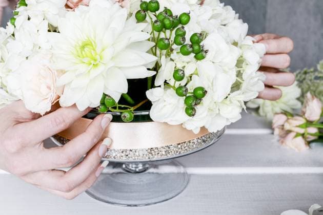 Florist at work. How to make floral decorations for summer party table. Centerpiece with rose, dahlia and hortensia flowers. Step by step, diy.  BEW1D9D1352