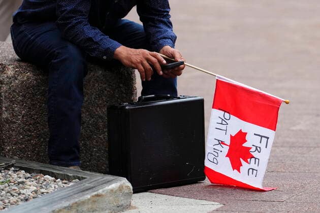July 18, 2022, Ottawa, Ontario, Canada: Supporters for convoy organizer Pat King await the decision outside his bail hearing at the Ottawa Courthouse in Ottawa on Monday, July 18, 2022. Ottawa Canada  - ZUMAc35_ 20220718_zaf_c35_040 Copyright: xSeanxKilpatrickx