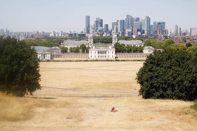 (220719) -- LONDON, July 19, 2022 -- A man sits in Greenwich Park in London, Britain, July 18, 2022. Much of the United Kingdom (UK) was gripped by scorching weather on Monday, with no respite from the sweltering heat forecast before the middle of this week. The authorities have warned of travel disruptions and suggested people work from home in the coming days. (Photo by Xinhua) BRITAIN-LONDON-HEATWAVE TimxIreland 