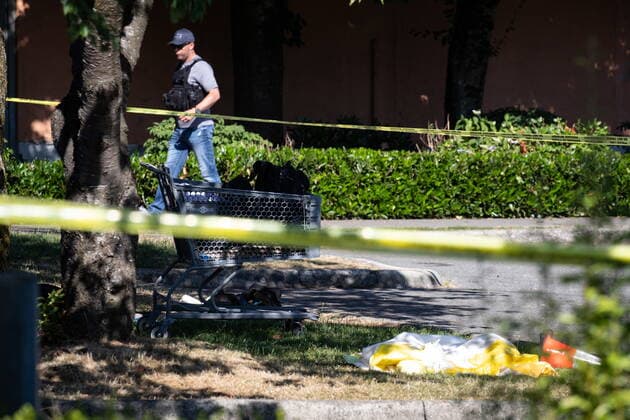 July 25, 2022, LANGLEY, BC, CANADA: A shopping cart with a person s belongings is seen behind police tape at one of three locations being investigated in regards to multiple shootings, in Langley, B.C., on Monday, July 25, 2022. A suspect is in custody after several people were shot in the Metro Vancouver city of Langley, RCMP said. Police issued a blaring cellphone alert at about 6:20 Monday morning, saying they were at the scenes of several shootings involving transient victims. LANGLEY CANADA - ZUMAc35_ 20220725_zaf_c35_122 Copyright: xDarrylxDyckx