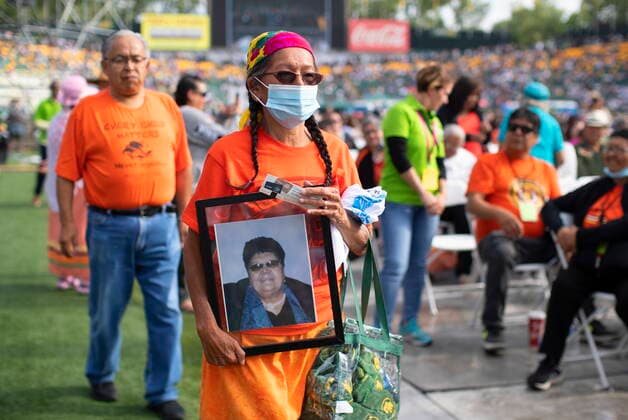 July 26, 2022, EDMONTON, ON, CANADA: Josephine Flaix hold a picture of her mother Florence Girous, who was a residential school survivor as people gather for Pope Francis presiding over mass in Edmonton, during his papal visit across Canada on Tuesday July 26, 2022. EDMONTON CANADA  - ZUMAc35_ 20220726_zaf_c35_018 Copyright: xJasonxFransonx