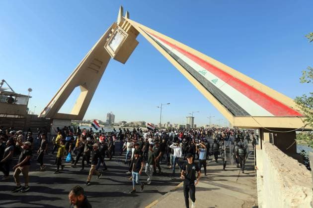 (220728) -- BAGHDAD, July 28, 2022 -- Followers of Shiite cleric Moqtada al-Sadr head towards the heavily fortified Green Zone in Baghdad, Iraq, July 27, 2022. Hundreds of followers of Shiite cleric Moqtada al-Sadr on Wednesday broke into the Iraqi parliament building in central Baghdad to protest against the nomination of Mohammed Shia al-Sudani for the post of prime minister. The protest came two days after the Coordination Framework, an umbrella group of Shiite parliamentary parties, nominated Mohammed Shia al-Sudani for the post of prime minister. ) IRAQ-BAGHDAD-PROTEST KhalilxDawood 