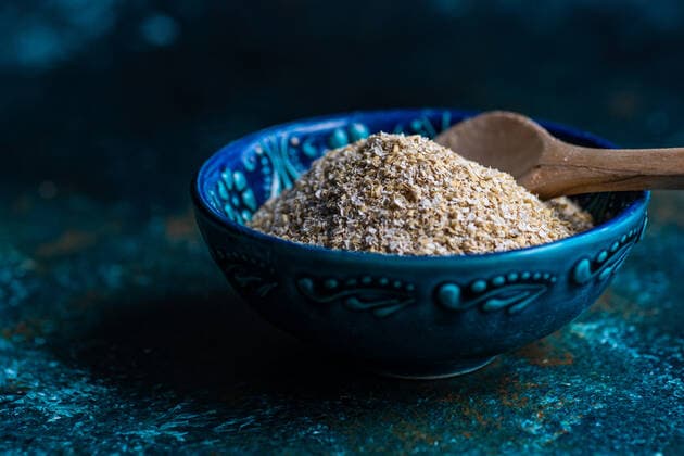 Healthy food concept with wholegrain otameal bran in the bowl AnnaBogush_DarkBran_1.jpg Copyright: xAnnaxBogushx Model Released