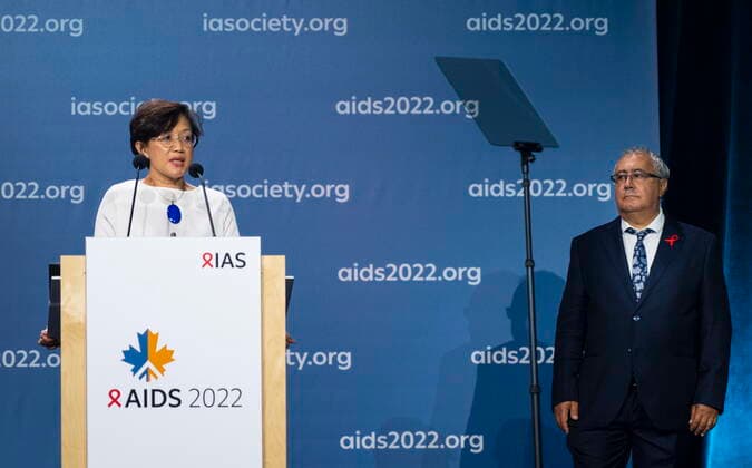 July 29, 2022, Montreal, PQ, Canada: Adeeba Kamarulzaman, president of the International Aids Society addresses the opening ceremony of the AIDS 2022 conference as co-chair Jean-Pierre Routy looks on in Montreal on Friday, July 29, 2022. Montreal Canada  - ZUMAc35_ 20220729_zaf_c35_014 Copyright: xPaulxChiassonx