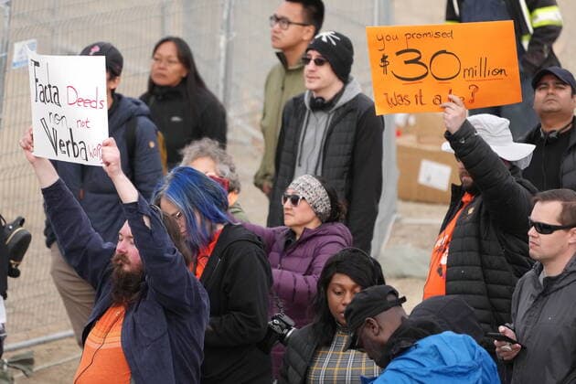 July 29, 2022, IQALUIT, NU, CANADA: Protesters hold signs as Pope Francis speaks during a public event in Iqaluit, Nunavut on Friday, July 29, 2022, during his papal visit across Canada. IQALUIT CANADA  - ZUMAc35_ 20220729_zaf_c35_075 Copyright: xNathanxDenettex