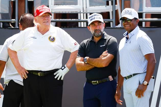 BEDMINSTER, NJ - JULY 30: Former President Donald Trump, Yasir Al-Rumayyan, Governor of the Public Investment Fund (PIF) the Sovereign wealth fund of the Kingdom of Saudi Arabia and Majed-Al-Sorour,-CEO-of-the-Saudi-Golf-Federation at the 1st tee prior to the start of the second round of LIV golf invitational series on July 30, 2022 in Bedminster, New Jersey. (Photo by Rich Graessle Icon Sportswire) Icon1013522351