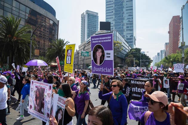 A group of women during a Feminist March with over 80,000 participants in Mexico city. In Mexico at least 10 women are killed everyday and there is a big gender inequality. At this march women mainly were dressed with purple, green and black. Purple symbolizes the rejection to violence against women, green symbolizes the right of women to decide about her own body and life, and black for mourning. Mexico. AlejandroxParis xMajorityxWorld 3 8 2020 925_02_MWC046112