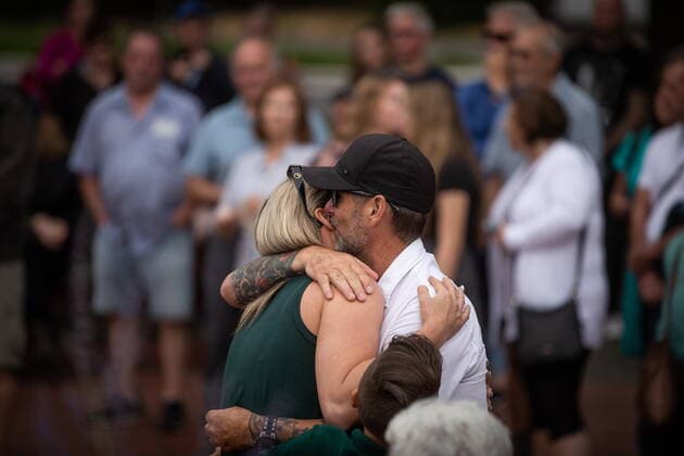 August 3, 2022, LANGLEY, BC, CANADA: John Wynn, right, embraces his girlfriend Marina Reimer after speaking about his late brother Paul Wynn during a vigil for him and Steven Furness, the two men who were killed by a gunman during a series of attacks on homeless people last month, in Langley, B.C., on Wednesday, August 3, 2022. The suspect believed to be responsible for the shooting of four people, including the two fatalities, was shot and killed by the RCMP. LANGLEY CANADA - ZUMAc35_ 20220803_zaf_c35_080 Copyright: xDarrylxDyckx