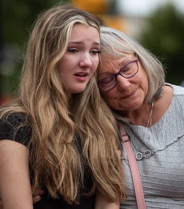 August 3, 2022, LANGLEY, BC, CANADA: Steven Furness daughter Lilee, 14, is comforted by her grandmother Lorraine Furness, right, during a vigil for her father and Paul Wynn, who were killed by a gunman during a series of attacks on homeless people last month, in Langley, B.C., on Wednesday, August 3, 2022. The suspect believed to be responsible for the shooting of four people, including the two fatalities, was shot and killed by the RCMP. LANGLEY CANADA - ZUMAc35_ 20220803_zaf_c35_083 Copyright: xDarrylxDyckx