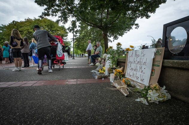 August 3, 2022, LANGLEY, BC, CANADA: A homeless person pushes a cart of belongings past a memorial for Steven Furness and Paul Wynn, during a vigil for the two men who were killed by a gunman during a series of attacks on homeless people last month, in Langley, B.C., on Wednesday, August 3, 2022. The suspect believed to be responsible for the shooting of four people, including the two fatalities, was shot and killed by the RCMP. LANGLEY CANADA - ZUMAc35_ 20220803_zaf_c35_085 Copyright: xDarrylxDyckx