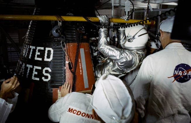 S63-07521 (15 May 1963) --- Astronaut L. Gordon Cooper Jr., pilot of the Mercury-Atlas 9 (MA-9) Earth-orbital space mission, is assisted into his Faith 7 Mercury spacecraft during the prelaunch countdown. MA-9 was launched on May 15, 1963, and the flight lasted for 34 hours and 20 minutes. Copyright: xpiemagsx piemagsspace-1056 !ACHTUNG AUFNAHMEDATUM GESCHÄTZT!