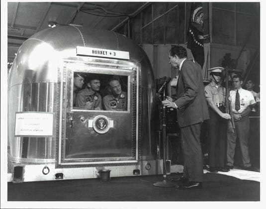 KENNEDY SPACE CENTER, FLA. - The Apollo 11 astronauts, left to right, Neil A. Armstrong, Michael Collins and Edwin E. Aldrin Jr., inside the Mobile Quarantine Facility aboard the USS Hornet, listen to President Richard M. Nixon as he welcomes them back to Earth and for a job well done. The astronauts, after their first manned mission to the Moon, splashed down in the Pacific Ocean at 12:50 p.m. EDT about 900 miles southwest of Hawaii. Copyright: xpiemagsx piemagsspace-1657 !ACHTUNG AUFNAHMEDATUM GESCHÄTZT!