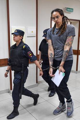 MOSCOW REGION, RUSSIA - AUGUST 4, 2022: US Olympic basketball champion Brittney Griner (R) is escorted for the verdict announcement at the Khimki Municipal Court in the town of Khimki, northeast of Moscow. Griner has been found guilty of smuggling and possession of drugs and sentenced to nine years in prison. Mikhail Voskresensky POOL TASS  TS13CFC6