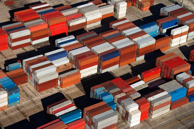 Aerial view of cargo containers piled together. Copyright: RonxChapplexStock 30254347