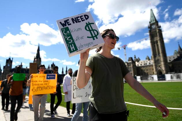 August 11, 2022, Ottawa, ON, CAN: Scientists and researchers rally on Parliament Hill to call on the federal government to increase funding for graduate and post-doctoral scholars, during the öÄuSupport Our ScienceöÄÃ¹ rally on Parliament Hill in Ottawa, on Thursday, Aug. 11, 2022. Ottawa CAN  - ZUMAc35_ 20220811_zaf_c35_032 Copyright: xJustinxTangx