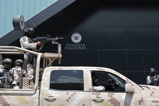 August 13, 2022, Tijuana, Baja California, Mexico: A convoy of three hundred military troops joined the elements of MexicoÃ¢â‚¬â ¢s National Guard at the Tijuana International Airport, a stone throw away from the U.S-Mexico border on Saturday, August 13, 2022, in response to FridayÃ¢â‚¬â ¢s simultaneous attacks on public transit and vehicles from armed crime organizations all over Baja California, 24 burned vehicles in the entire state, 15 in Tijuana alone. No deaths or victims were reported...So far, 17 suspects have been arrested for the violent acts recorded yesterday in Tijuana, Mexicali, Ensenada and Rosarito. Tijuana Mexico - ZUMAm180 20220813_zip_m180_002 Copyright: xCarlosxA.xMorenox