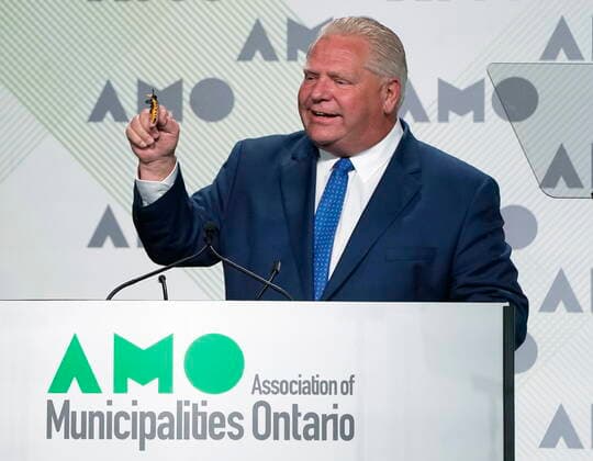 August 15, 2022, Ottawa, ON, Canada: Ontario Premier Doug Ford holds up a toy bee as he jokes about swallowing a bee before speaking to the Association of Municipalities Ontario conference, Monday, August 15, 2022 in Ottawa. Ottawa Canada  - ZUMAc35_ 20220815_zaf_c35_002 Copyright: xAdrianxWyldx