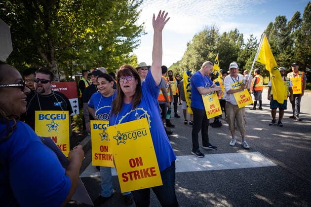 August 15, 2022, DELTA, BC, CANADA: British Columbia General Employees Union president Stephanie Smith, front right, joins employees on the picket line outside a B.C. Liquor Distribution Branch facility, in Delta, B.C., on Monday, August 15, 2022. The BCGEU, which represents approximately 33,000 public-service workers across B.C., issued strike notice last Friday. DELTA CANADA - ZUMAc35_ 20220815_zaf_c35_059 Copyright: xDarrylxDyckx