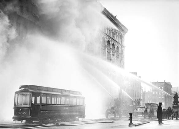 Fireman spraying water on burning building, 14th Street, New York City, New York, USA, Bain News Service, December 1909  Copyright: xCircaxImagesx ghi-circa11152