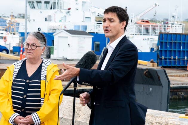 August 19, 2022, Žles-de-la-Madeleine, Que, Canada: Prime Minister Justin Trudeau is accompanied by Minister of National Revenue Diane Lebouthillier as he speaks at Les ÃŽles-de-la-Madeleine, Que., Friday, Aug. 19, 2022. Îles-de-la-Madeleine Canada  - ZUMAc35_ 20220819_zaf_c35_012 Copyright: xNigelxQuinnx