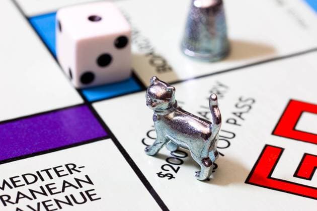 LOS ANGELES, CA USA - MAY 8, 2015: Monopoly board game macro image. Monopoly is a board game that originated in the United States. , 18033026.jpg, Close-up, Colorful, Fun, Game, Hasbro, Macro, Monopoly game, Parker Brothers, Vintage, activity, blue, board, cat, complete, dice, entertainment, figurine, icon, leisure, lose, piece, red, retro, thimble, tile, win,