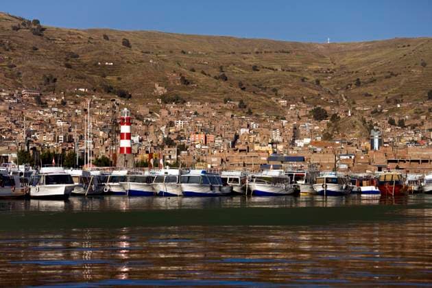 Town of Puno on the banks of Lake Titicaca in Peru , 18283078.jpg, Peru, Puno, town, port, Lake Titicaca, lighthouse, view, boats, harbor, marina, travel, tourism, South America,