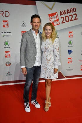 Sebastien Ogier rally driver with wife Andrea Kaiser TV presenter on arrival to the SPORT BILD Awards ceremony at the Fischauktionshalle in Hamburg on 22 08 2022