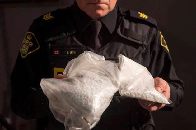 February 23, 2017, Vaughan, ON, Canada: An OPP officer displays bags containing fentanyl as Ontario Provincial Police host a news conference in Vaughan, Ont., on February 23, 2017. Opioids have killed more people in Ontario in the second year of the pandemic compared to the first, but there was a drop in deaths in March, newly released data show, giving the chief coroner some hope that trend continues. The deadly drugs continue to kill people at a much higher rate in the province s north compared to the south. And opioids are also killing young people, specifically men aged 25 to 44, more than other age groups, the data shows. Vaughan Canada - ZUMAc35_ 20170223_zaf_c35_128 Copyright: xChrisxYoungx