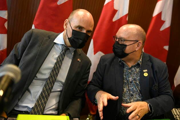 August 23, 2022, Ottawa, ON, CAN: Sylvain Brosseau, President of the Canadian Nursing Association, right, speaks with Minister of Health Jean-Yves Duclos after a news conference announcing the appointment of Dr. Leigh Chapman as CanadaöÄÃ s Chief Nursing Officer, in Ottawa, on Tuesday, Aug. 23, 2022. Ottawa CAN - ZUMAc35_ 20220823_zaf_c35_023 Copyright: xJustinxTangx