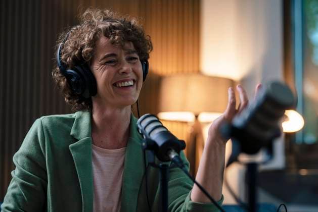 Cheerful radio DJ wearing headset recording in studio model released, Symbolfoto property released, JOSEF11204
