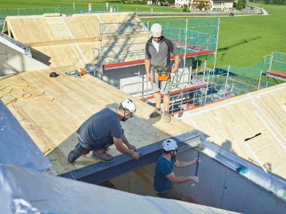 Carpenters with tools installing roof at construction site model released, Symbolfoto property released, CVF02117