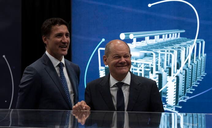 August 23, 2022, Stephenville, NFLD, Canada: Canadian Prime Minister Justin Trudeau and German Chancellor Olaf Scholz share a laugh as they tour a trade fair on Tuesday, August 23, 2022 in Stephenville, Newfoundland and Labrador. Stephenville Canada  - ZUMAc35_ 20220823_zaf_c35_073 Copyright: xAdrianxWyldx