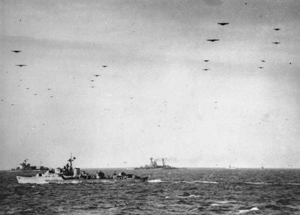 The Royal Navy during the Second World War- Operation Overlord (the Normandy Landings)- D-day 6 June 1944 Glider borne troops passing over units of the Royal Navy on their way to the invasion beaches of Normandy. In the background are the battleships HMS WARSPITE and HMS RAMILLIES whilst an unidentified destroyer sails in the middle distance. Photograph taken from the cruiser FROBISHER, which had helped bombard the enemy coastal positions during the week before D-Day. Copyright: xpiemagsx admiralww2pie10322-3944 !ACHTUNG AUFNAHMEDATUM GESCHÄTZT!