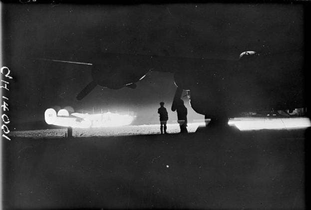 The Battle of the Atlantic 1939-1945 Anti-Submarine Weapons: A Royal Air Force Liberator illuminated by a Leigh Light on the airfield at St Eval. Copyright: xpiemagsx airministryww2pie13032022-3963 !ACHTUNG AUFNAHMEDATUM GESCHÄTZT!