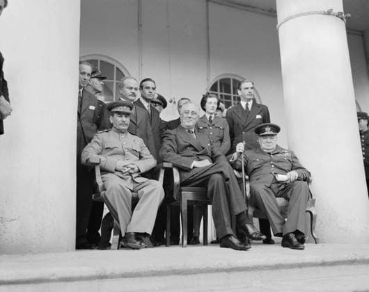 The Teheran Conference, 28 November - 1 December 1943 Joseph Stalin, Franklin D Roosevelt and Winston Churchill sit together for photographs during the Teheran Conference between 28 November and 1 December 1943. The British Foreign Secretary Anthony Eden stands behind Churchill, the Soviet Foreign Minister Vyacheslav Molotov stands behind Stalin and Section Officer Sarah Oliver (Churchill s daughter) stands behind Roosevelt. Copyright: xpiemagsx airministryww2pie13032022-4116 !ACHTUNG AUFNAHMEDATUM GESCHÄTZT!