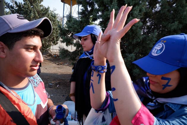 August 25, 2022, Tehran, Tehran, Iran: Female soccer fans prepare to attend a match between their team Esteghlal and Mes-e Kerman in Iran s Premier League at Azadi stadium in Tehran, Iran, Aug. 25, 2022. A limited number of Iranian women have been allowed into a stadium in Tehran to watch a league football match for the first time. Tehran Iran - ZUMAi98_ 20220825_zih_i98_052 Copyright: xRouzbehxFouladix