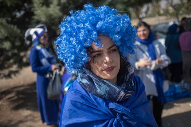 Iranian Women Allowed To Watch Football Match After FIFA Pressure An Iranian soccer female fan wearing a hat and a flag while waiting to enter the Azadi (Freedom) stadium in western Tehran for watching a soccer match between Esteghlal F.C. and Mes Kerman, August 25, 2022. For the first time after the victory of the Iranian Islamic Revolution, 500 female football fans were allowed to enter the Azadi Stadium to watch the matches of the Iranian Premier League. Tehran Iran  Copyright: xMortezaxNikoubazlx originalFilename: nikoubazl-iransocc220825_npce1.jpg