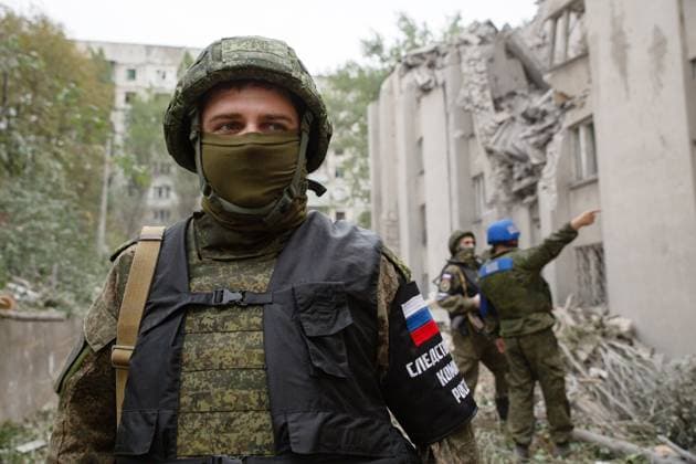 LUGANSK PEOPLE S REPUBLIC - AUGUST 26, 2022: Russian Investigative Committee officers survey damage caused by a military strike involving HIMARS multiple rocket launchers by Ukraine s armed forces on the town of Stakhanov. Early on 26 August 2022, the Armed Forces of Ukraine fired 10 HIMARS rockets on the town. The attack caused damage to the Donbass Hotel. The Russian Armed Forces are carrying out a special military operation in Ukraine in response to requests from the leaders of the Donetsk People s Republic and Lugansk People s Republic for assistance. Alexander Reka TASS  TS13F639