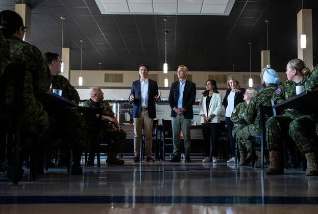 August 26, 2022, COLD LAKE, AB, CANADA: Prime Minister Justin Trudeau, left and NATO Secretary General Jens Stoltenberg speak to military during a luncheon with members of the Canadian Armed Forces at 4 Wing Cold Lake air base in Cold Lake Alta, on Friday August 26, 2022. COLD LAKE CANADA  - ZUMAc35_ 20220826_zaf_c35_034 Copyright: xJasonxFransonx