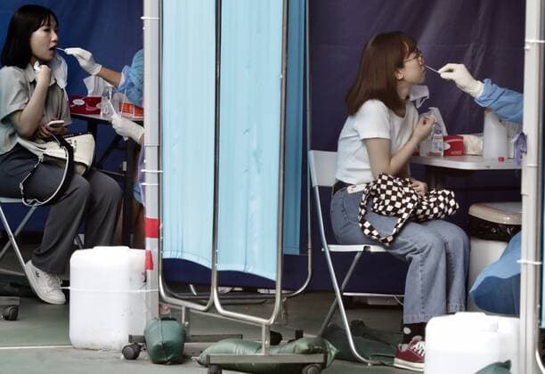 September 5, 2022, Hong Kong, China: Female citizens receiving sampling tests inside the booth at Covid-19 Community Testing Centre in Hong Kong as new case of infections hit 5 digit numbers everyday. Hong Kong China - ZUMAl137 20220905_zap_l137_005 Copyright: xLiauxChung-renx