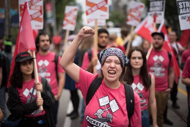 September 5, 2022, TORONTO, ON, CANADA: Participants chant as they march through Toronto during the Labour Day Parade on Monday, September 5, 2022. TORONTO CANADA  - ZUMAc35_ 20220905_zaf_c35_041 Copyright: xTijanaxMartinx