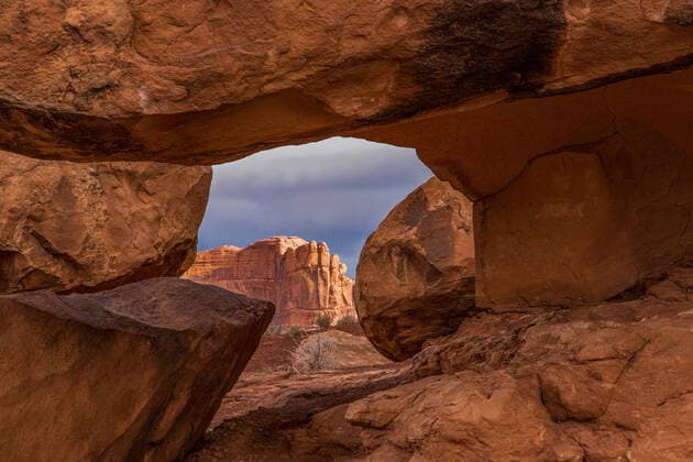 Creative Highlights World The Tower of Babel as framed by rocks in front of the Organ in the Courthouse Towers, Arches National Park, Moab, Utah. Moab Arches National Park Utah United States Copyright: xJonxG.xFullerx 2014-JGF-Arches NP-Courthouse Towers-US-UT