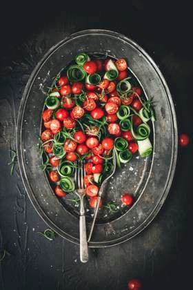 Tomato and cucumber salad on a metal plate Tomato and cucumber salad on a metal plate Copyright: xClaudiaxSilverstonex CS150822-2