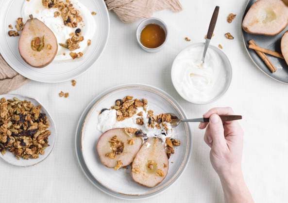 Poached Pears served with yogurt and maple granola. Poached Pears served with yogurt and maple granola. Copyright: xJennxDavisx JD190618-62