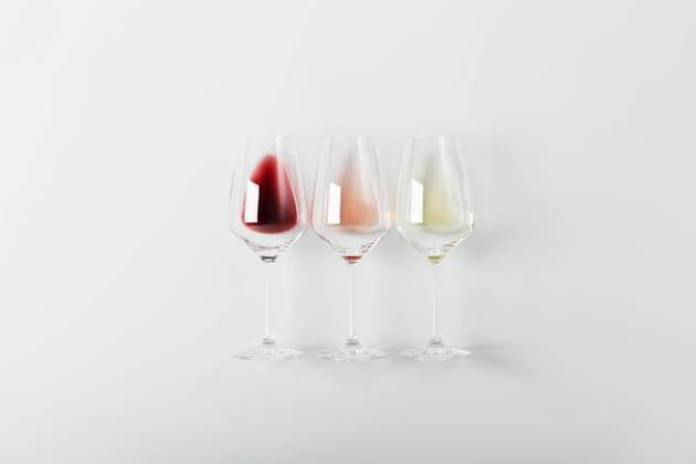 Flat-lay of red, rose and white wine in glasses on white background Flat-lay of red, rose and white wine in glasses on white background. Wine bar, winery, wine degustation concept. Minimalistic trendy photography Copyright: xNataliaxKlenovax NK200622-30