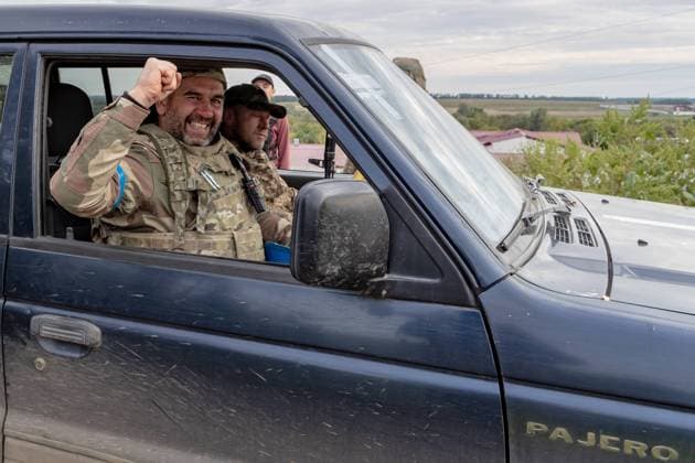 A Ukrainian soldier gestures with their hand as they smile and shouts Glory to Ukraine during a military convoy passing by Husarivka towards eastern Ukraine on Saturday, Sept 10, 2022. (VX Photo Vudi Xhymshiti), Ukraine send reinforcements to its Eastern border Husarivka Undisclosed Location Kharkiv Oblast Ukraine  , Copyright: xVudixXhymshitix
