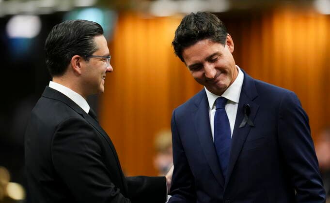 September 15, 2022, Ottawa, ON, CAN: Prime Minister Justin Trudeau and Conservative leader Pierre Poilievre greet each other as they gather in the House of Commons on Parliament Hill to pay tribute to Queen Elizabeth in Ottawa on Thursday, Sept. 15, 2022. Ottawa CAN  - ZUMAc35_ 20220915_zaf_c35_003 Copyright: xSeanxKilpatrickx