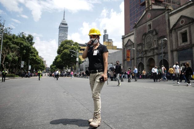 (220919) -- MEXICO CITY, Sept. 19, 2022 -- A member of the Mexican National Civil Protection works after an earthquake in Mexico City, Mexico, on Sept. 19, 2022. An earthquake with a magnitude of 7.4 shook Mexico on Monday, according to preliminary data, with further details unavailable at the moment. ) MEXICO-MEXICO CITY-EARTHQUAKE FranciscoxCanedo 